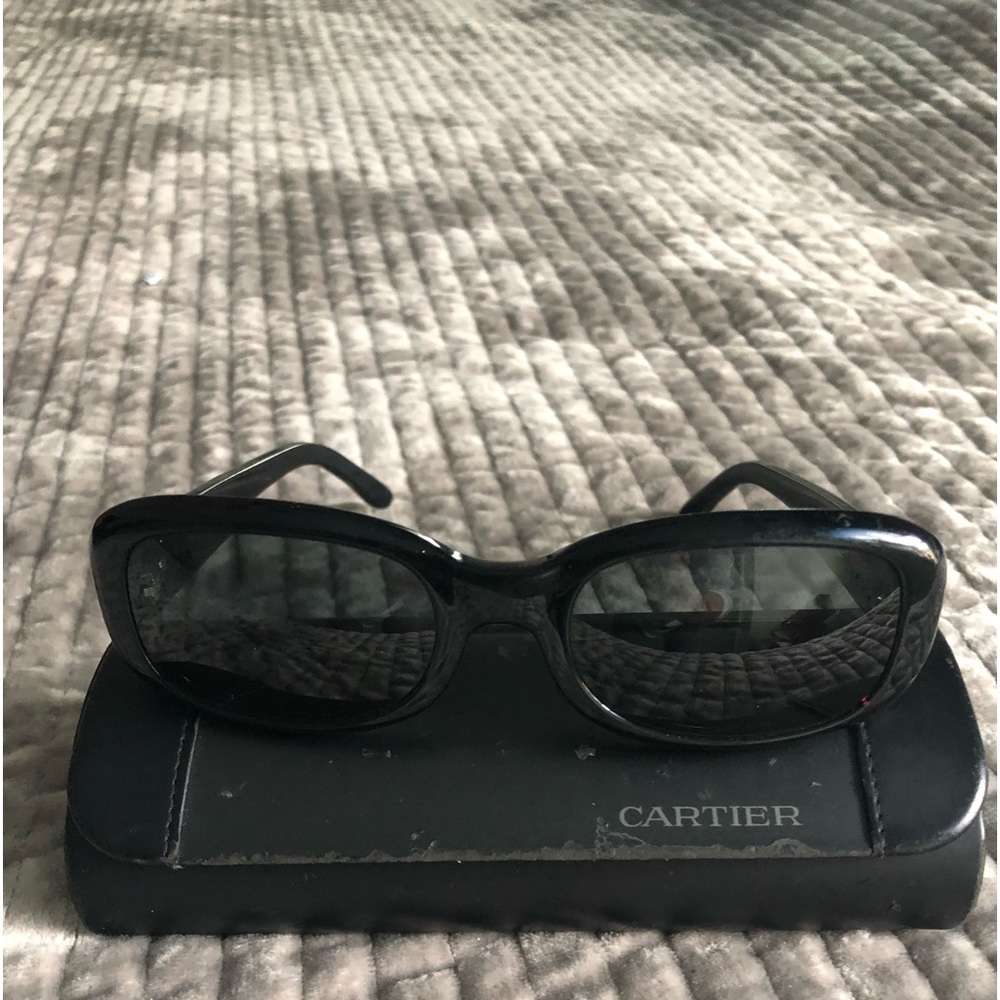 Black vintage Cartier rectangle sunglasses.